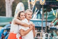 Portrait of two young people walking at city park posing at camera. Sensual feelings of in love couples concept image