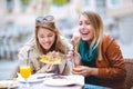 Portrait of two young women eating pizza outdoors Royalty Free Stock Photo