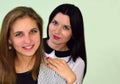 Portrait of two young women. The woman the blonde and the woman the brunette s. Royalty Free Stock Photo