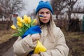 Portrait of Ukrainian woman holding tulip flowers Royalty Free Stock Photo