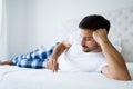 Portrait of unhappy man lying on bed Royalty Free Stock Photo
