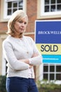 Portrait Of Unhappy Mature Woman Forced To Sell Home Through Financial Problems Royalty Free Stock Photo