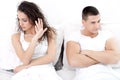 Portrait of unhappy young couple in bedroom Royalty Free Stock Photo