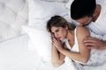 Portrait of unhappy young couple in bedroom Royalty Free Stock Photo