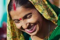 Portrait of an unidentified lady with traditional make-up wearing a scarf at the street of Varanasi, India.