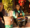 Portrait of unidentified old woman near stupa Boudhanath. Royalty Free Stock Photo