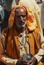 Portrait of an unidentified senior hindu man wearing glasses at the street in Orchha, India.