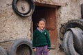 Portrait of unidentified tibetan girl in front of at home.