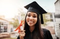 Portrait, university and Latino woman with certificate, graduation and scholarship with education, knowledge and degree