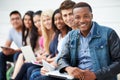 Portrait Of University Students Outdoors On Campus