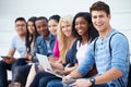 Portrait Of University Students Outdoors On Campus