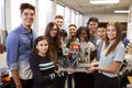 Portrait Of University Students With Teacher Holding Machine In Science Or Robotics Class