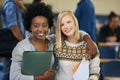 Portrait, university and women students in classroom with text books and documents for information. Smile, happy and Royalty Free Stock Photo