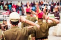 Portrait of unrecognizable indian policeman saluting each other