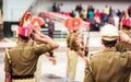 Portrait of unrecognizable indian policeman saluting each other