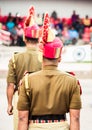 Portrait of an unrecognizable indian policeman standing in a row. Rear view