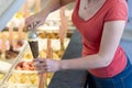 Ice cream shop with a saleswoman preparing an ice cream chocolate cone