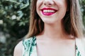 Portrait of unrecognizable young woman smiling at sunset. Red lips and beautiful smile. Happiness concept Royalty Free Stock Photo