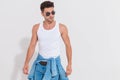 Portrait of unshaved man wearing tank top looking to side Royalty Free Stock Photo