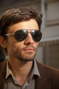 Portrait of an unshaven man model with sunglasses Royalty Free Stock Photo