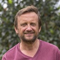 Portrait of an unshaven middle-aged man relaxing on the nature in summer day Royalty Free Stock Photo