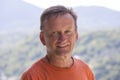 Portrait of an unshaven middle-aged man relaxing on the nature in summer day Royalty Free Stock Photo