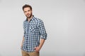 Portrait of unshaven young man posing on camera with hands in pockets Royalty Free Stock Photo