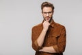 Portrait of unshaven young man posing and looking at camera Royalty Free Stock Photo