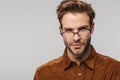 Portrait of unshaven young man posing and looking at camera