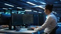 Portrait of upbeat admin in data center managing servers
