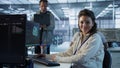 Portrait of upbeat woman working in high tech AI facility