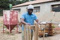 Upset afro american man observing the destruction of his home