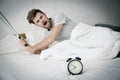 Portrait upset angry with baseball hit young man screaming at alarm clock Royalty Free Stock Photo