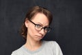 Portrait of upset girl with eyeglasses pouting lips