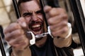 Portrait of upset handcuffed man imprisoned for crime, punished for serious villainy. Arrest, gangster, pain concept Royalty Free Stock Photo