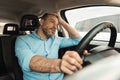 Upset bored man driving new car in city Royalty Free Stock Photo