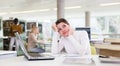 Portrait of upset tired female student preparing for exam in university library Royalty Free Stock Photo