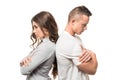 Portrait of upset unhappy couple standing back to back holding arms crossed ignoring each other isolated on white Royalty Free Stock Photo