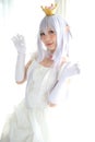 Portrait of vampire dracula young woman dress in white tone room halloween concept