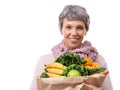 Portrait, vegetables and old woman with fruit, smile and nutrition isolated on a white studio background. Face