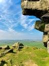 Portrait or vertical shot of Almscliffe Crag a millstone grit outcrop in North Yorkshire