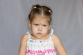 Portrait of very angry little girl on white background Royalty Free Stock Photo