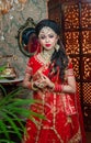 Portrait of very beautiful sexy indian bride in red lehenga showing navel. Non Bengali bridal portrait Royalty Free Stock Photo