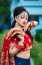 Portrait of very beautiful sexy indian bride in red lehenga showing navel. Non Bengali bridal portrait Royalty Free Stock Photo