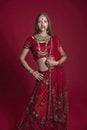 Portrait of very beautiful young Indian bride in luxurious bridal costume with makeup and heavy jewellery Royalty Free Stock Photo