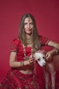 Portrait of very beautiful young Indian bride in luxurious bridal costume with makeup and heavy jewellery Royalty Free Stock Photo