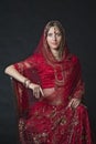 Portrait of very beautiful young Indian bride in luxurious bridal costume with makeup and heavy jewellery Royalty Free Stock Photo