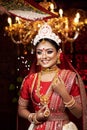 Portrait of very beautiful young Indian bride in luxurious bridal costume with makeup and heavy jewellery for Wedding fashion. Royalty Free Stock Photo