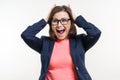 Portrait of very happy surprised adult business woman holding her head in amazement. White Background Studio Royalty Free Stock Photo