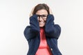 Portrait of very happy surprised adult business woman holding her head in amazement. White Background Studio Royalty Free Stock Photo